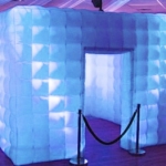 Elegant light changing inflatable photo booth rental.