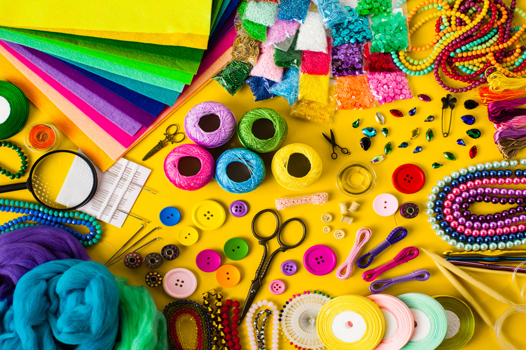 Colorful arts and crafts supplies including markers, ribbons, and beads. Discover a variety of arts and crafts supplies to inspire creativity at your next event in Wilmington, DE.