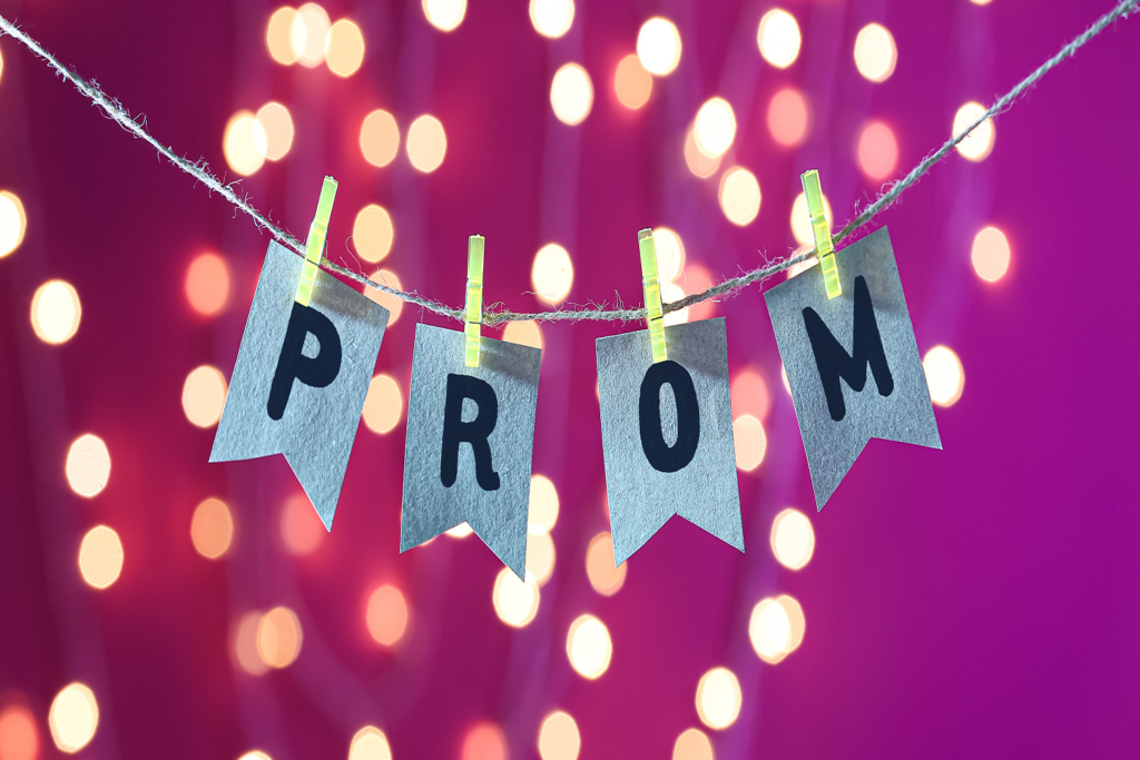 Post prom party setup with 'PROM' banner and bokeh lights. Keep the celebration going with post prom party rentals in Wilmington, DE.