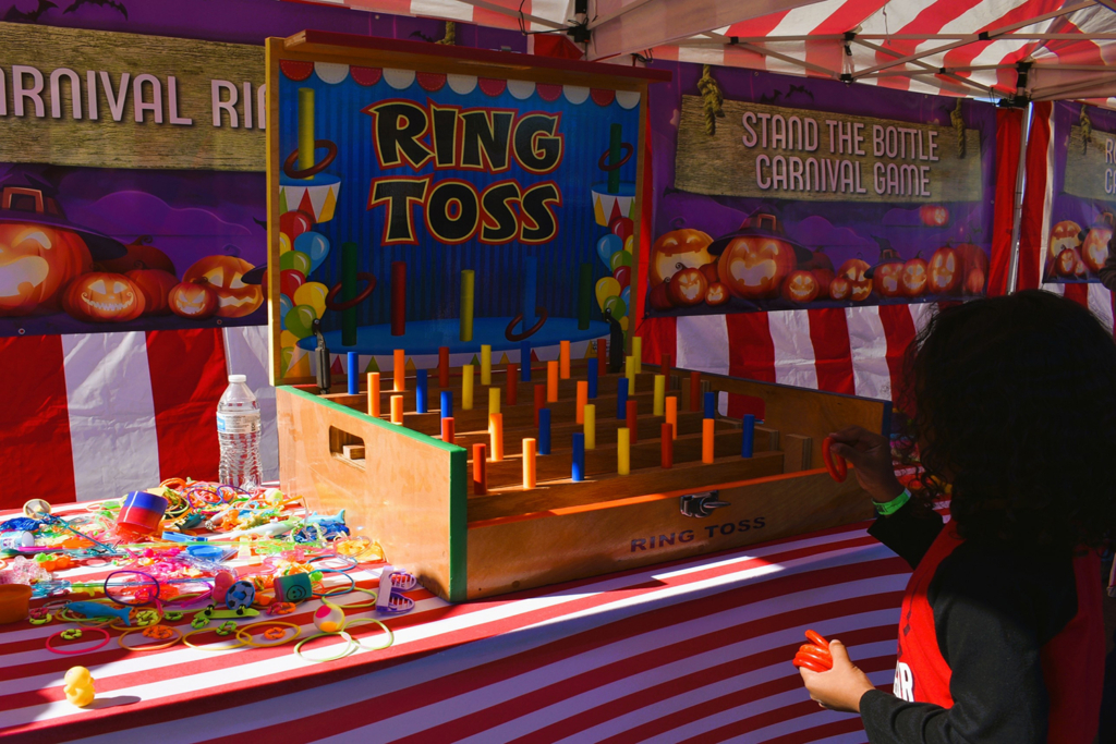 Kid playing carnival ring toss in Wilmington, DE