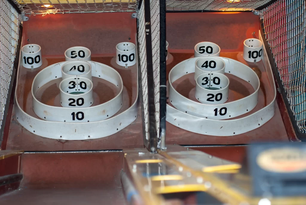 Two Skee-Ball lanes side by side showing the scoring rings
