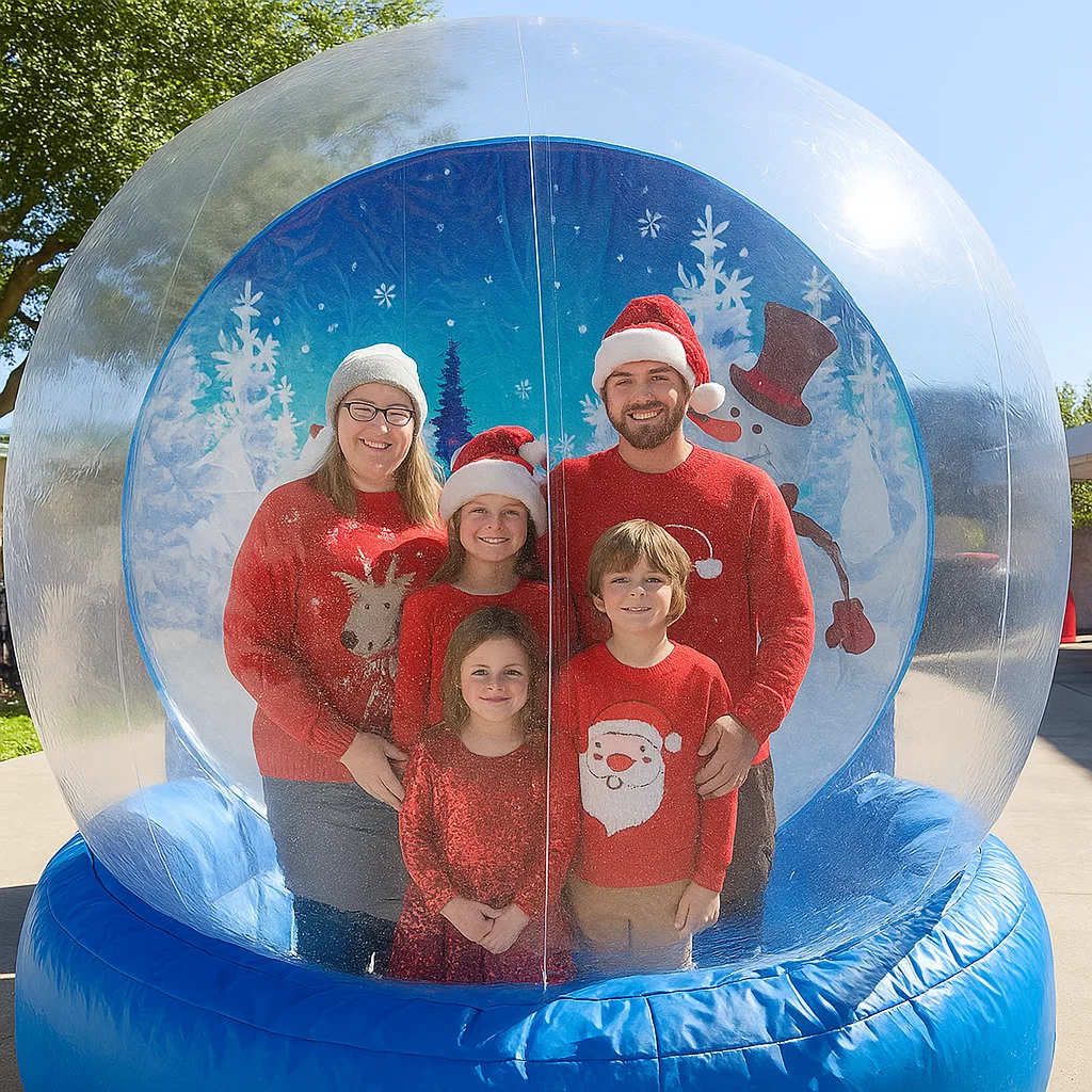 Guests enjoy snow globe photo booth rental at New Year celebration
