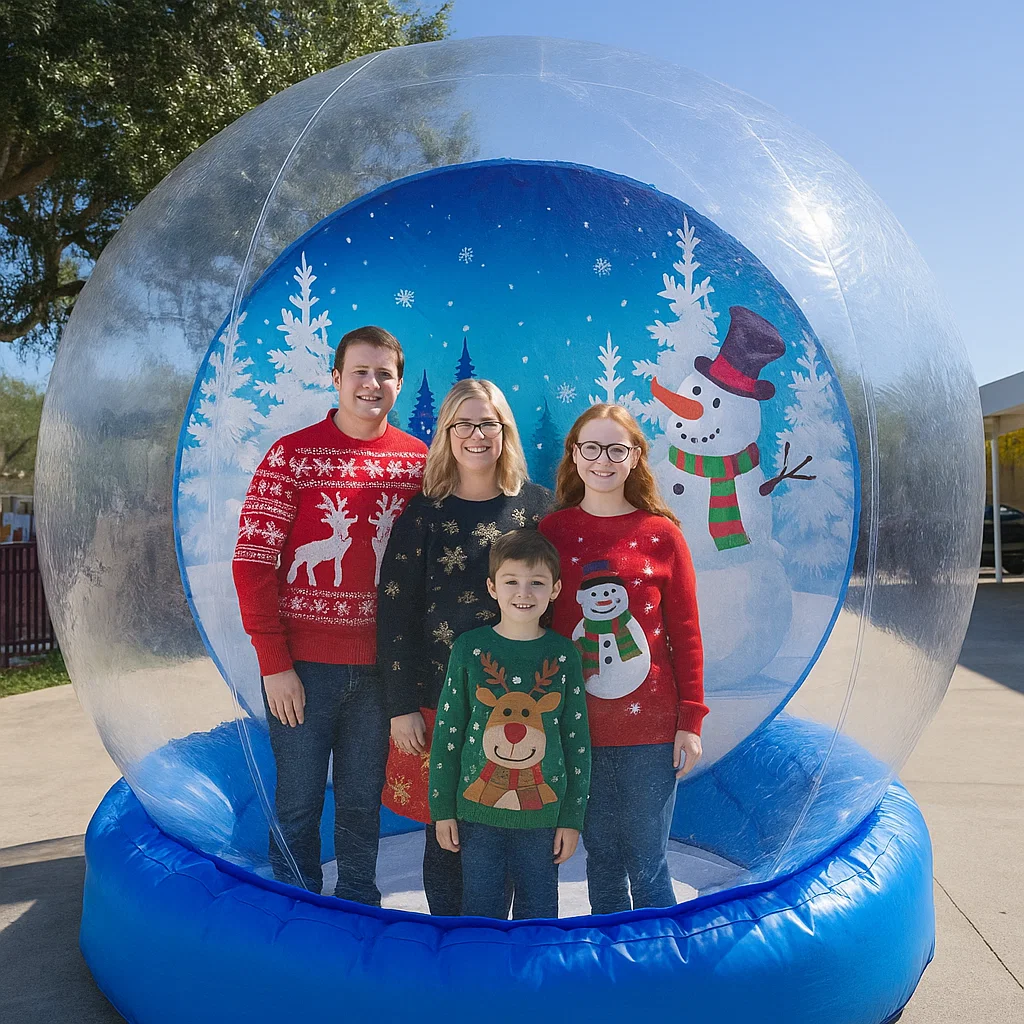 giant inflatable snow globe rental with guests posing for photos for town tree lighting