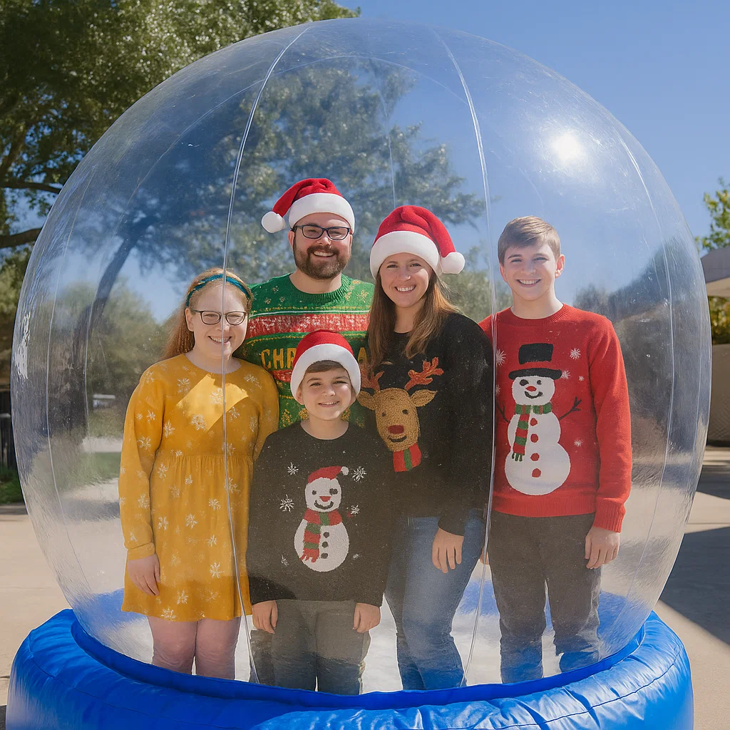 Guests enjoy snow globe photo booth rental at New Year celebration — compact footprint for lobbies