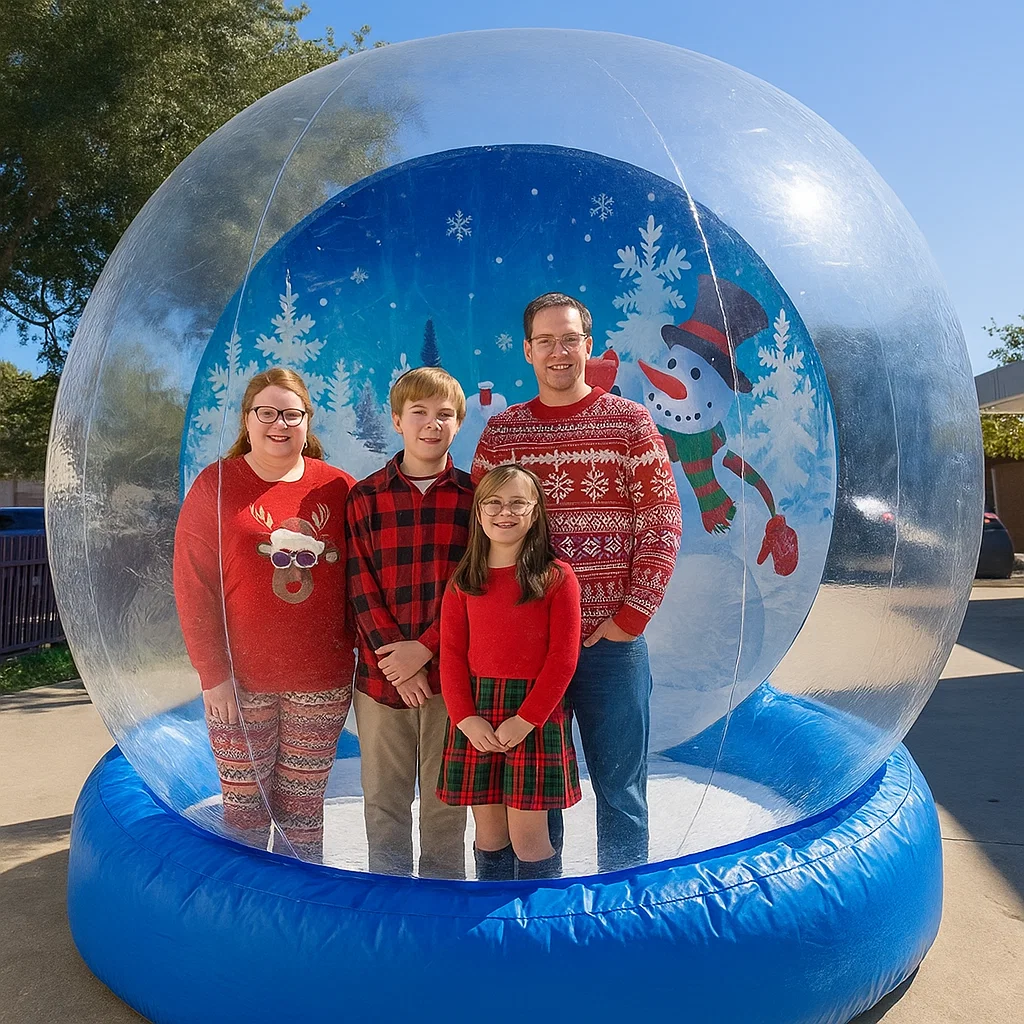 Branded human snow globe setup for sports halftime show — kids and parents smiling