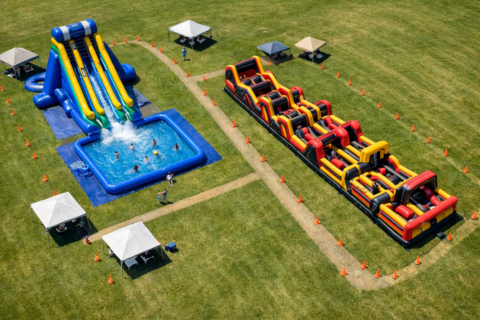 Aerial view of inflatable water slide and obstacle course zones set up for a large outdoor event.