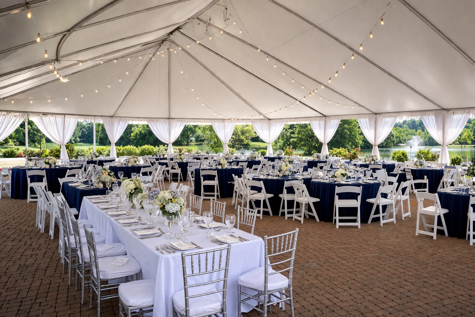 Tent, table and chair rentals in Delaware with event seating set under a party tent