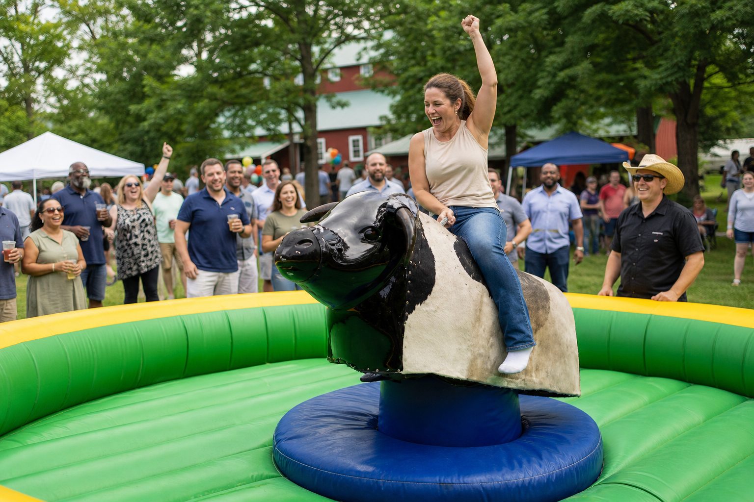 Employee riding a mechanical bull at a supervised Blue Bell company picnic
