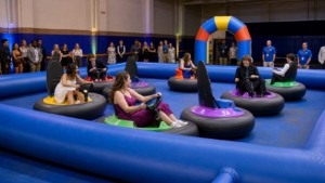 Students driving bumper cars at a supervised Blue Bell after-prom