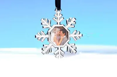 Silver snowflake photo ornament holding a guest photo