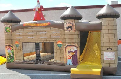 Wizards Castle 4-in-1 combo bounce house with a slide